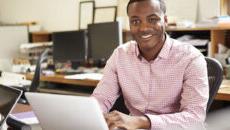 Guy on laptop in office